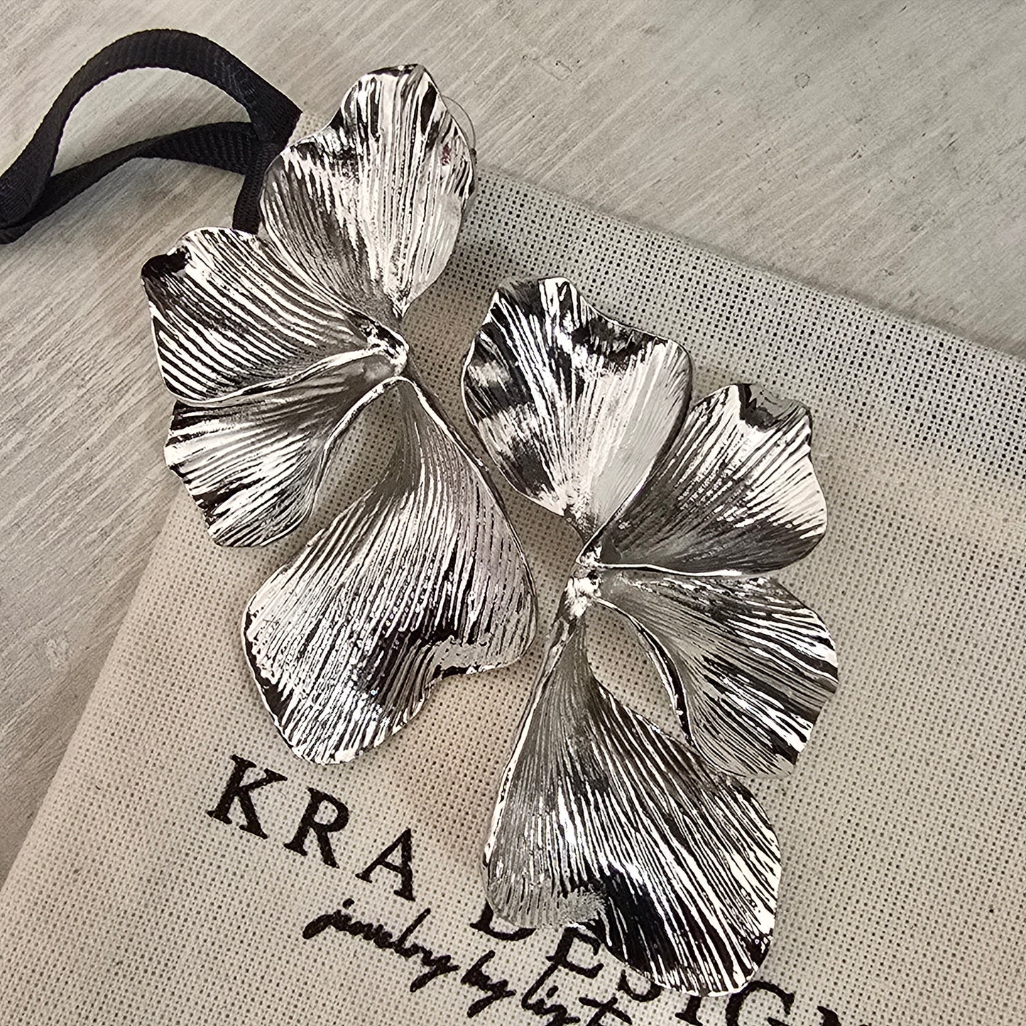 Aretes semi flor plata