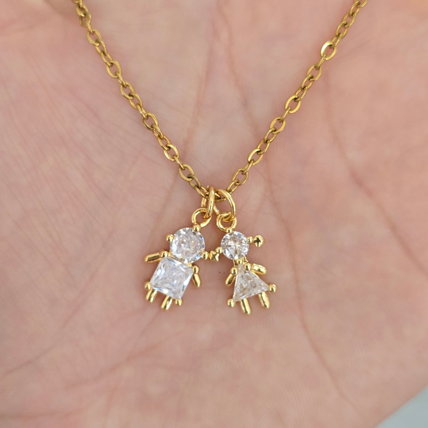 Cadena 2 dijes de niños cristal