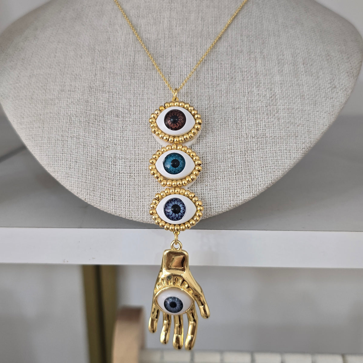 Cadena ojos y manita hamsa