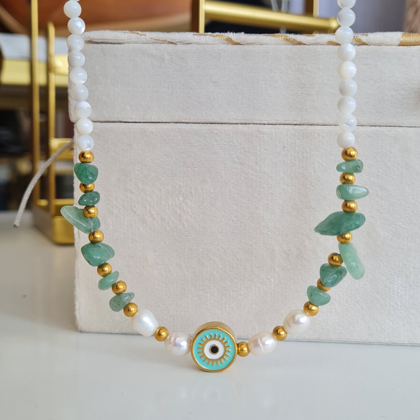 Green eye necklace