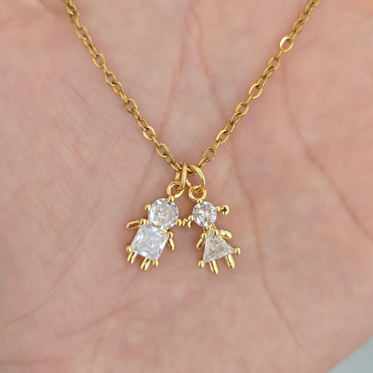 Cadena 2 dijes de niños cristal