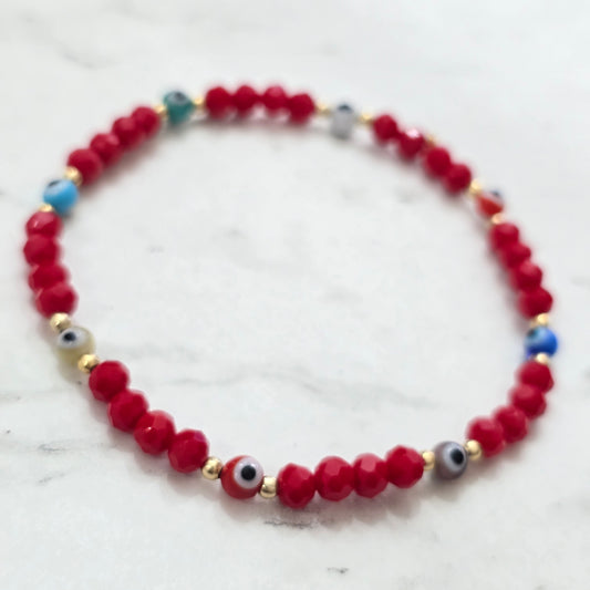 Pulsera elastico ojitos colores