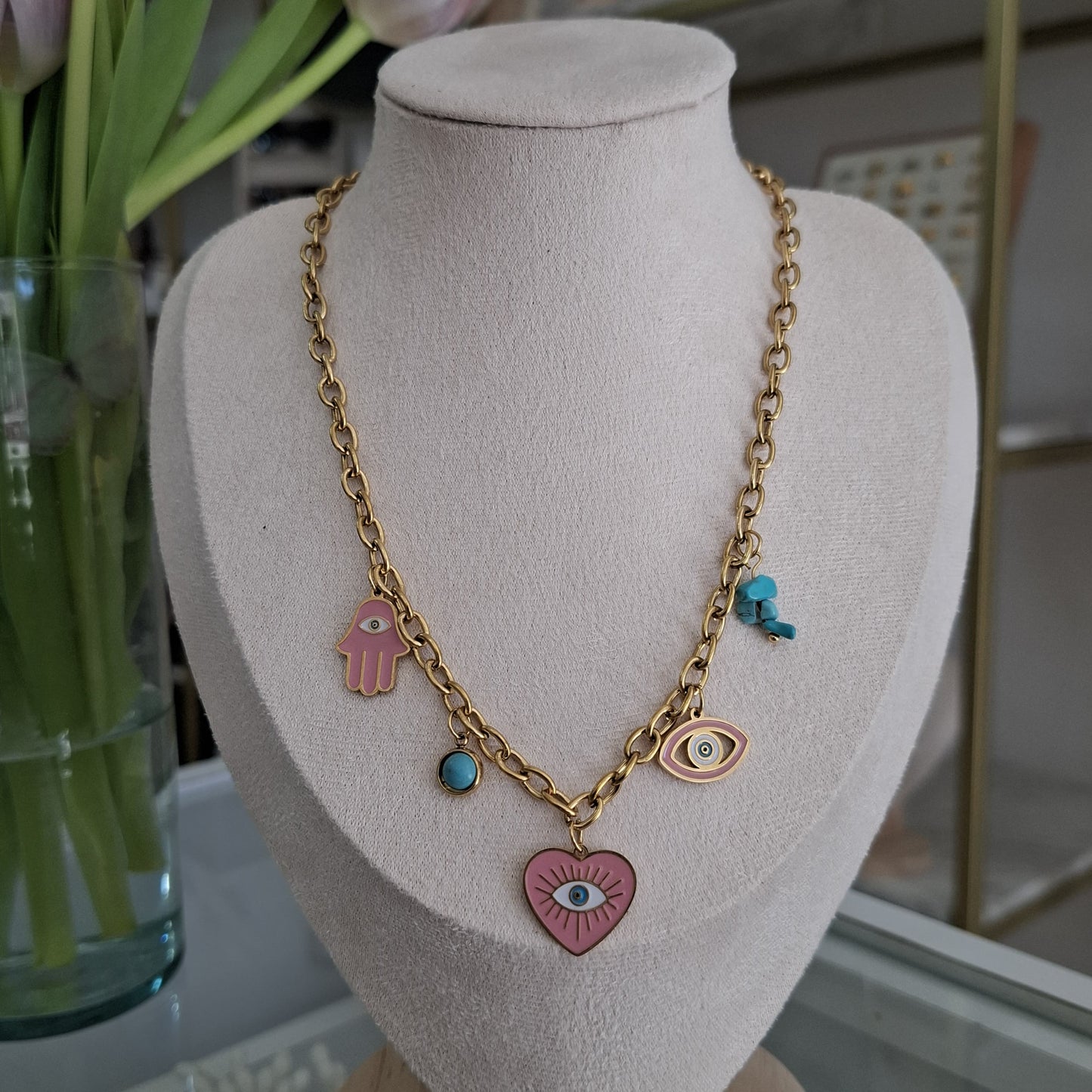 Collar multicharms de ojitos rosas